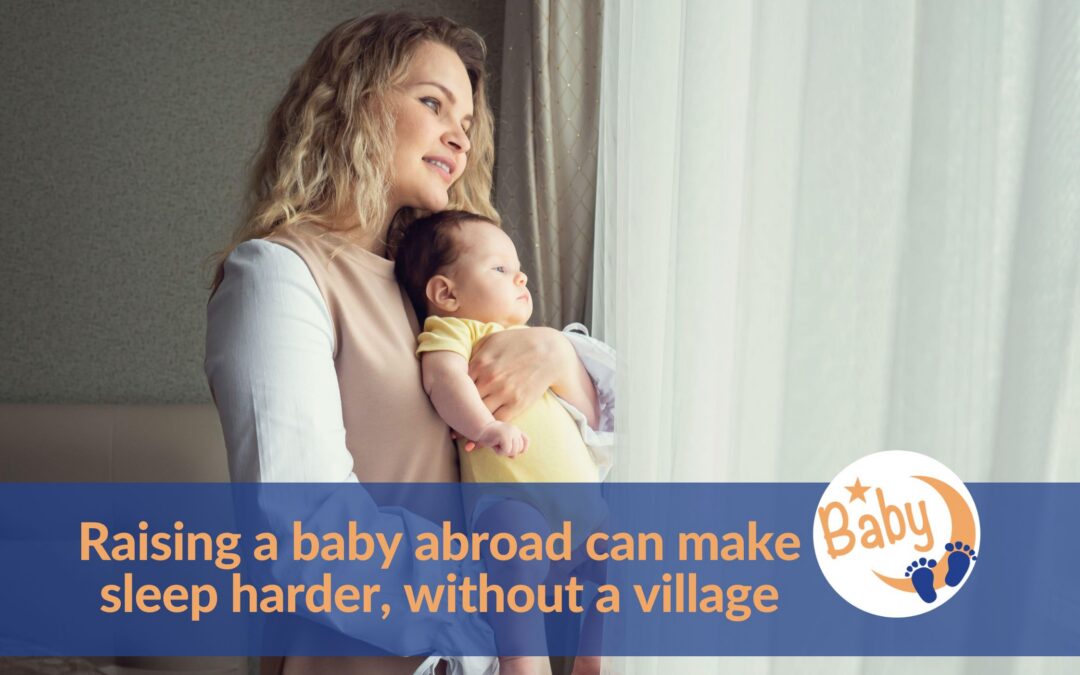 Mother holding her baby by a window on the topic of raising a baby abroad without your village